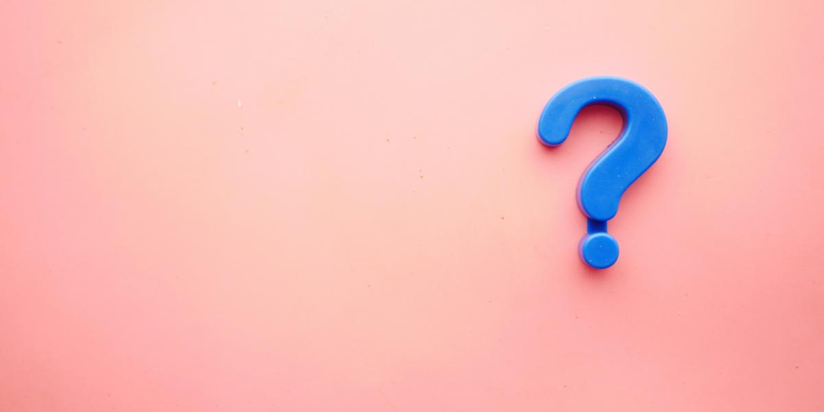 question mark on salmon pink background